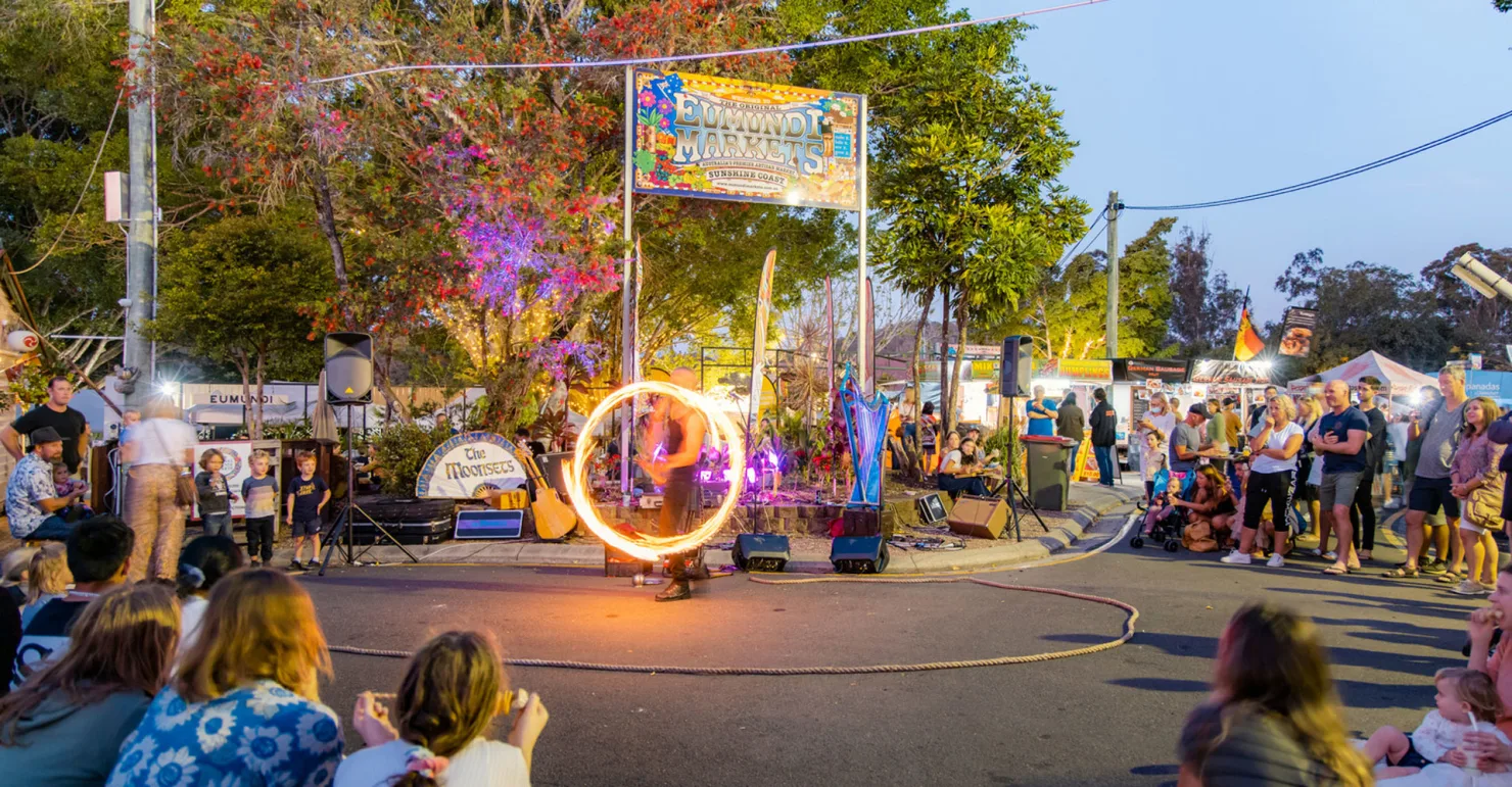 Fire twirler at Eumundi Markets