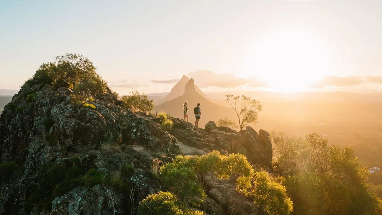 Hiking at sunset on Mount Ngungun, Glass House Mountains