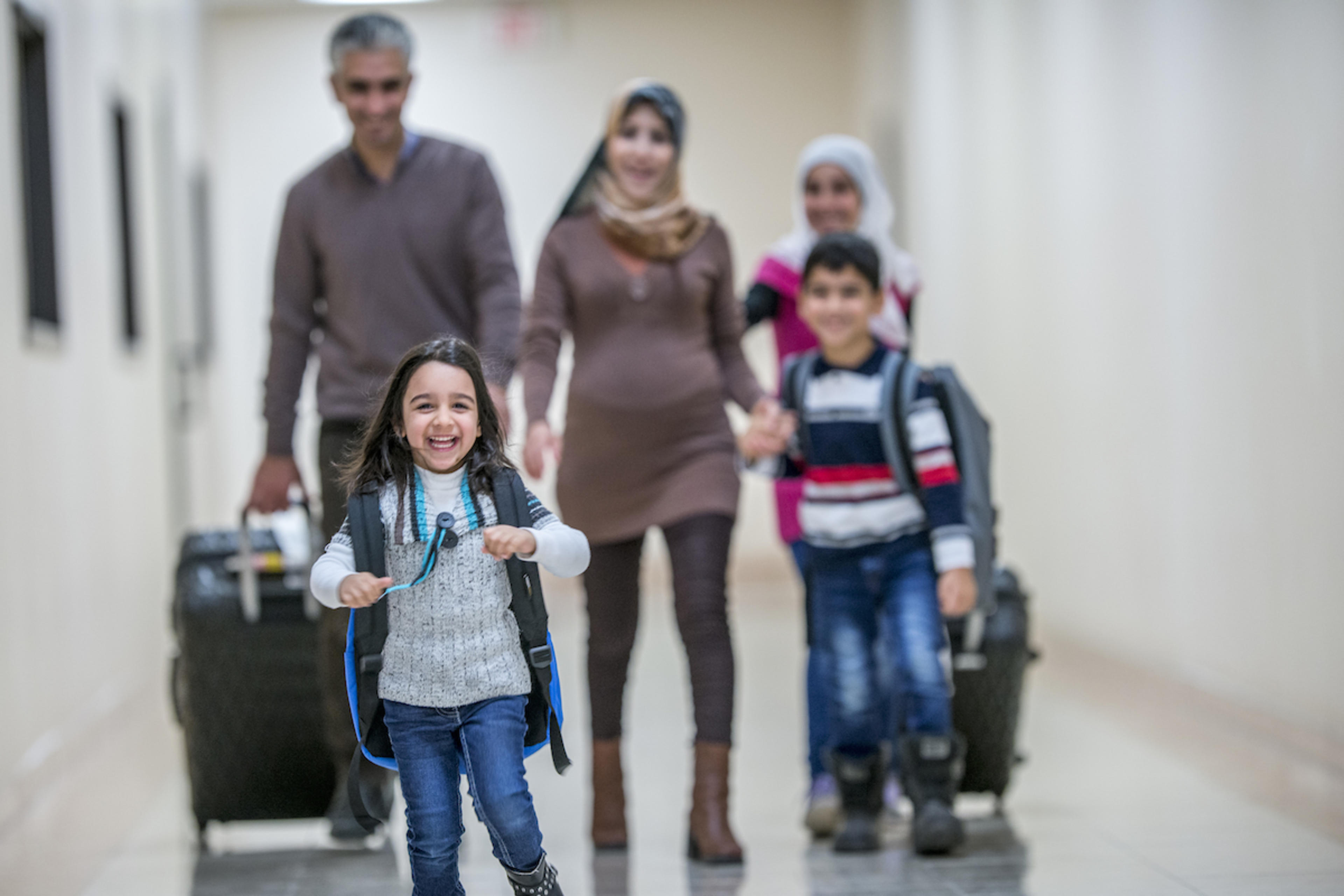 A family walks towards the camera