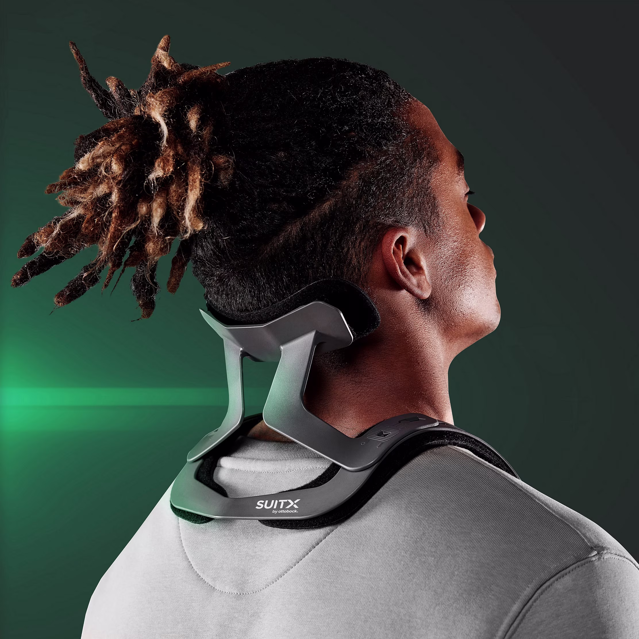 Back view of a man in gray clothing resting his head on the CX Easy Neck