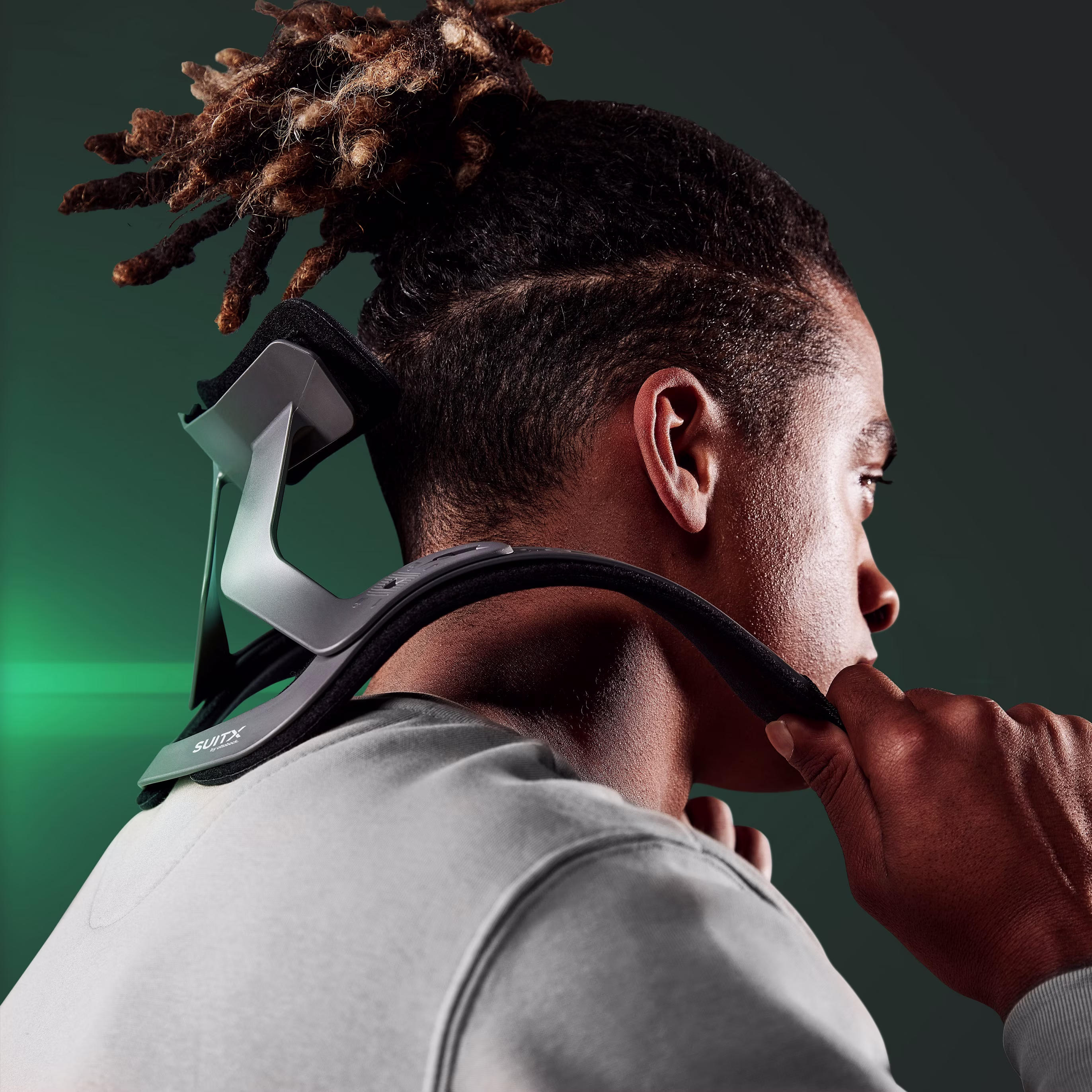 View of a man putting the CX Easy Neck on his shoulder