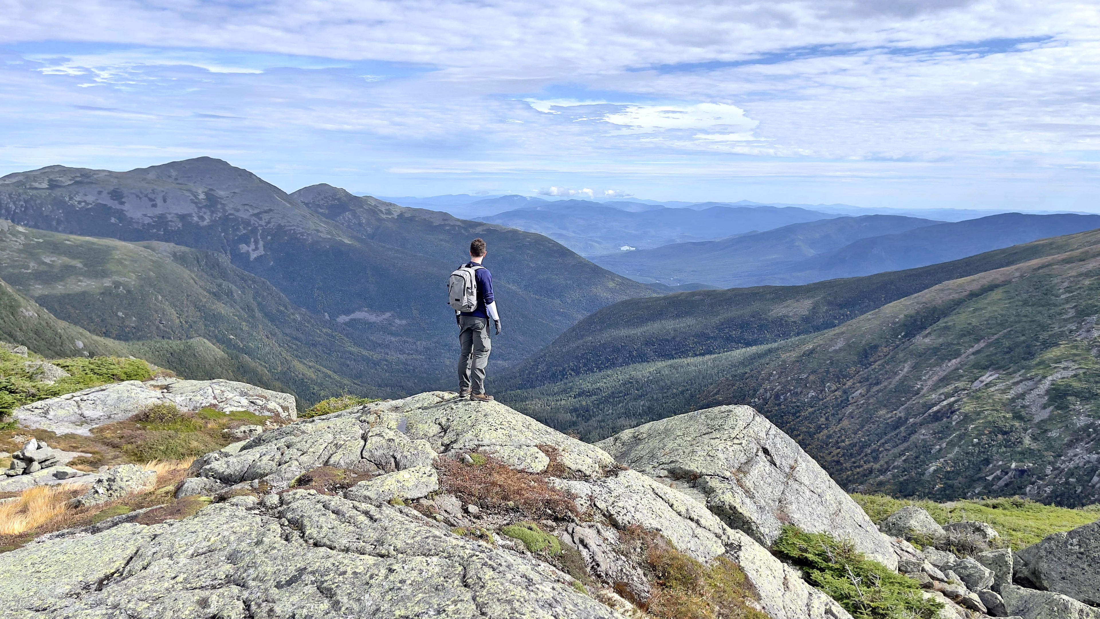 My husband in awe of the view while hiking Mount Washington.