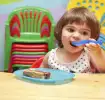 Toddler-eating--with-mum-encouraging