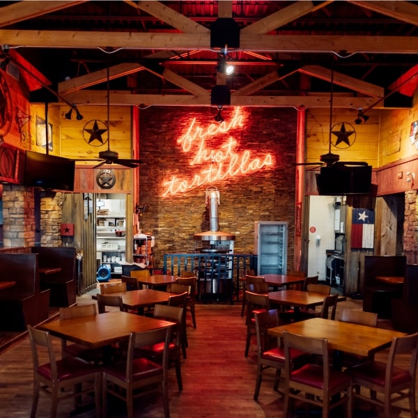 Empty Lone Star restaurant with neon sign for Fresh Cut Tortillas