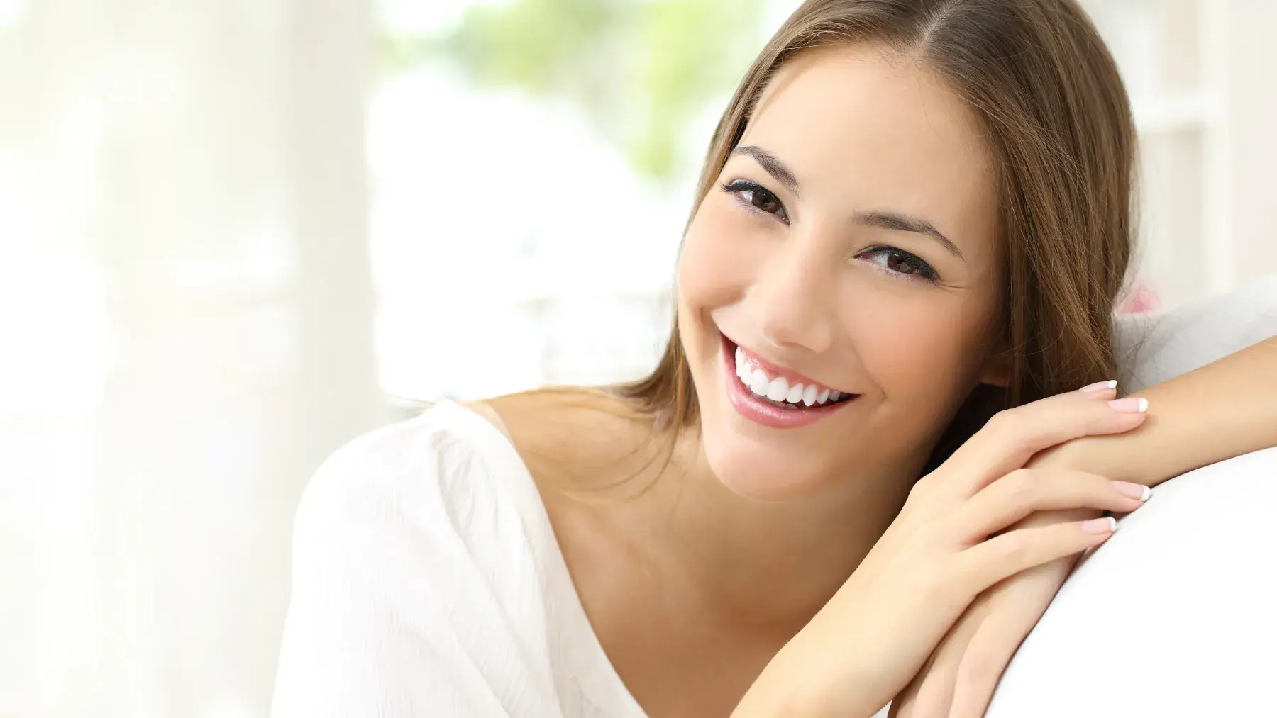 Smiling woman demonstrating teeth whitening easy habits that keep teeth white
