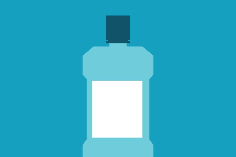 A bottle of mouthwash with a white label on a blue background