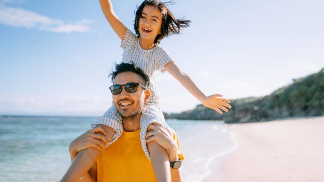 Man and child smiling