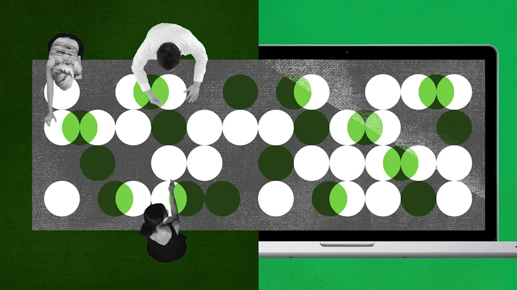 Overhead view of three developers working on a project on a conference table. Next to it is the same project shown on a laptop screen.