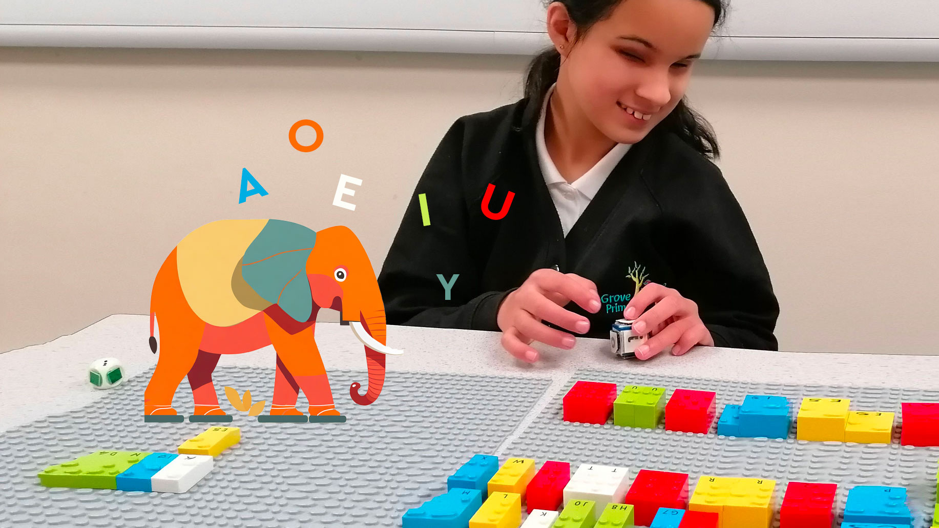 Student plays a letter game with LEGO Braille Bricks and a dice. 