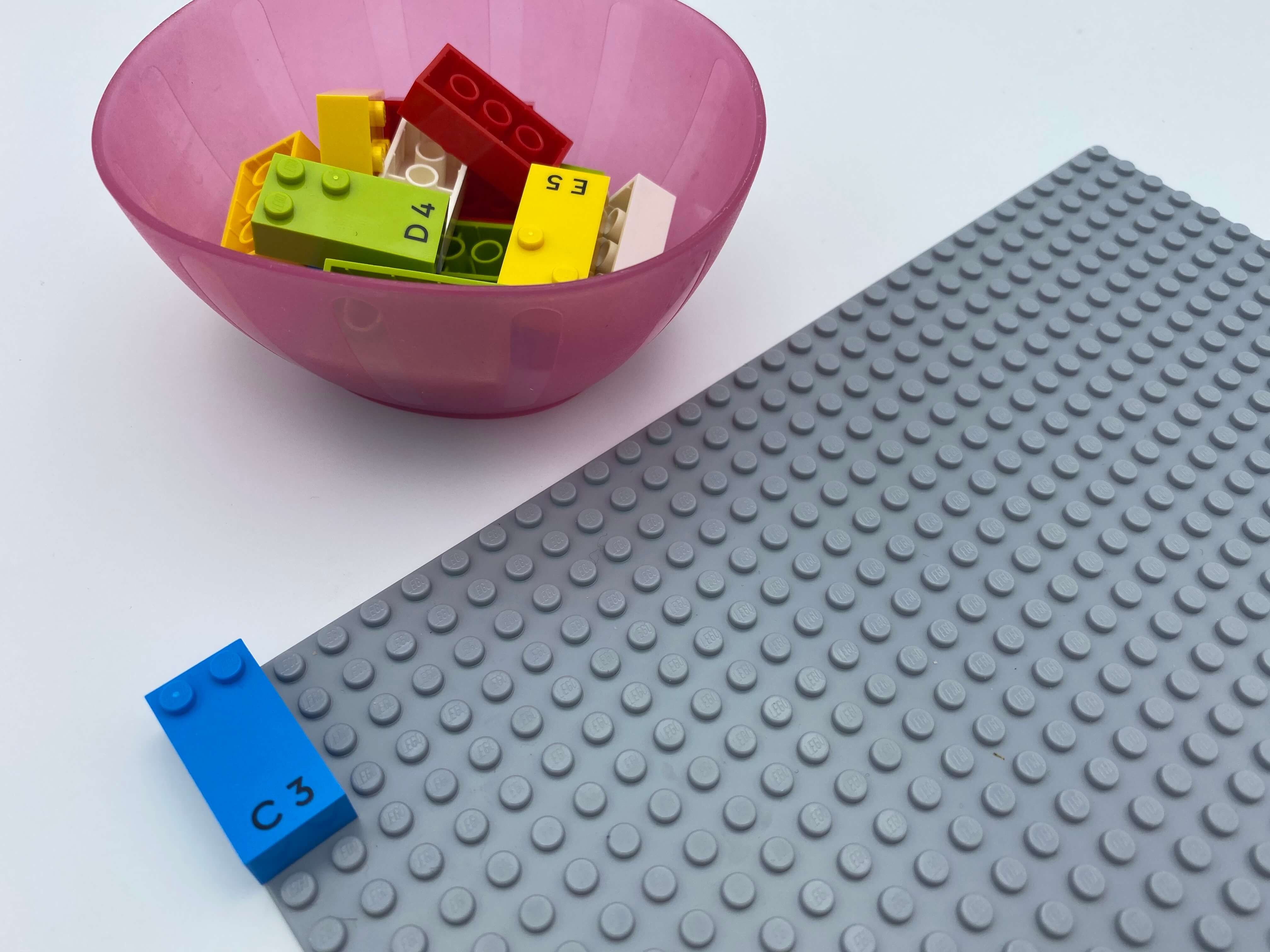 A vertical brick attached at the top left corner, a bowl with bricks.