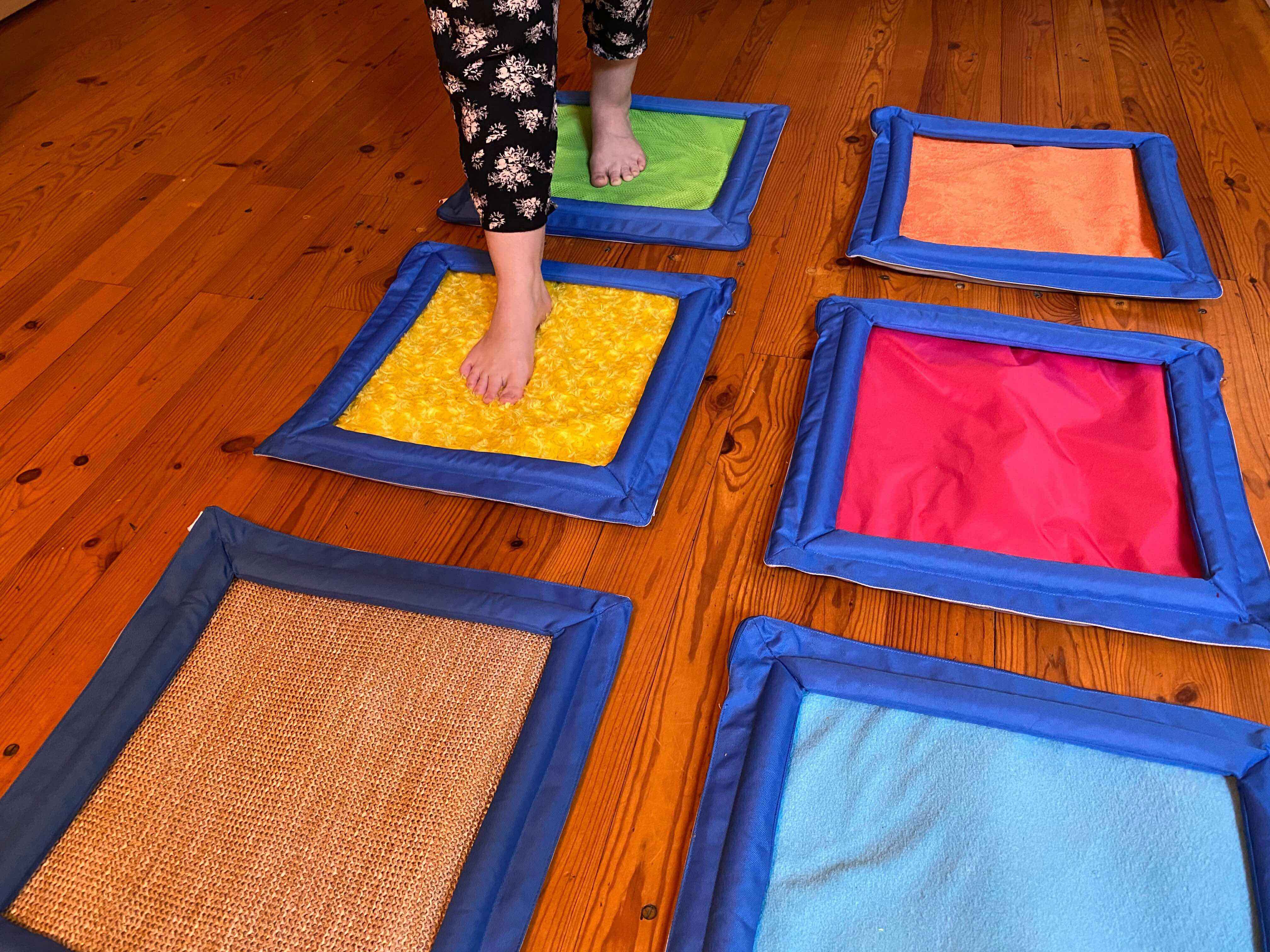 A giant braille cell of 6 hoops on the floor. Someone is moving from hoop 1 to hoop 2.