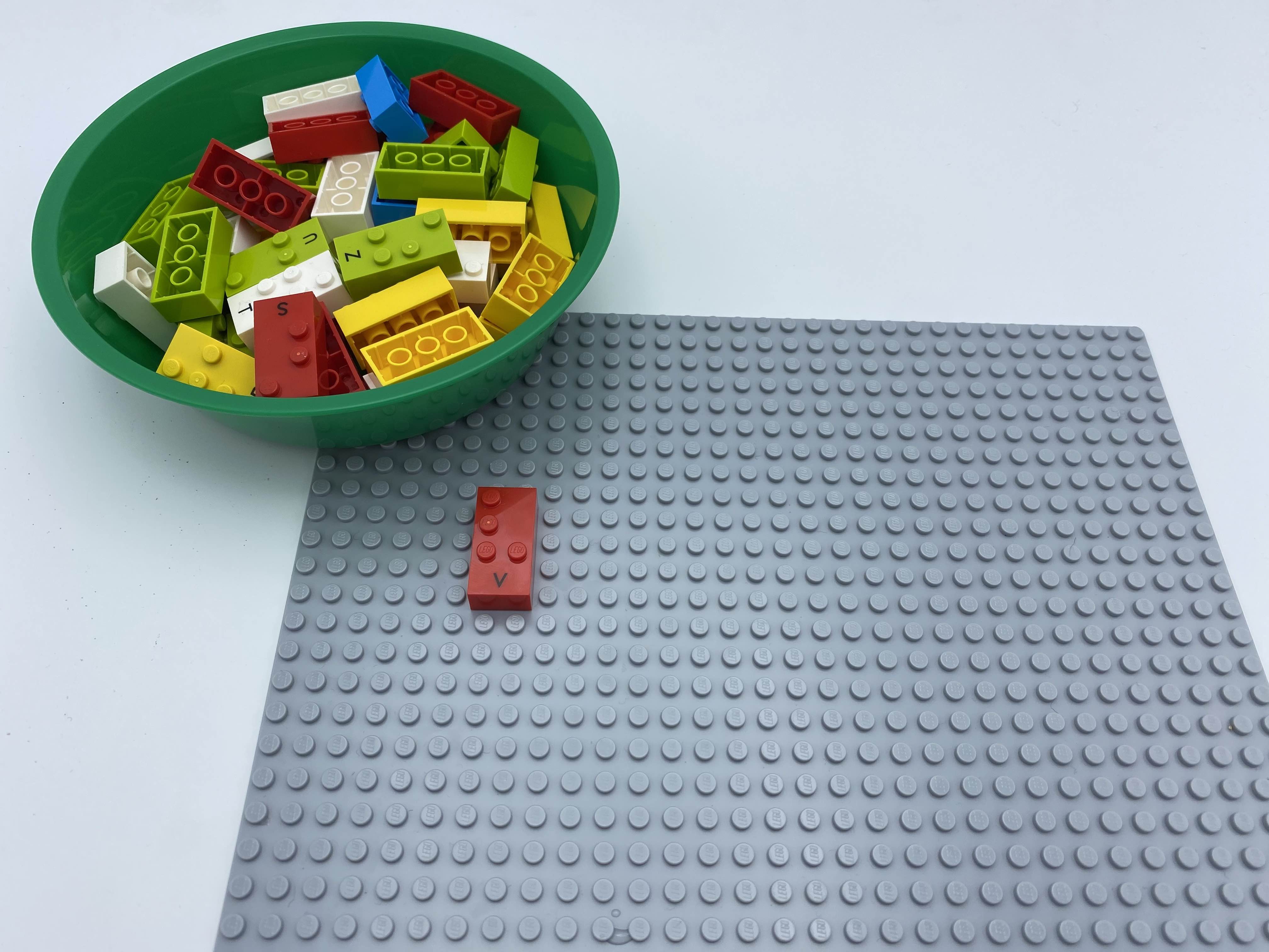One bricks is attached on the plate, the others are in the bowl