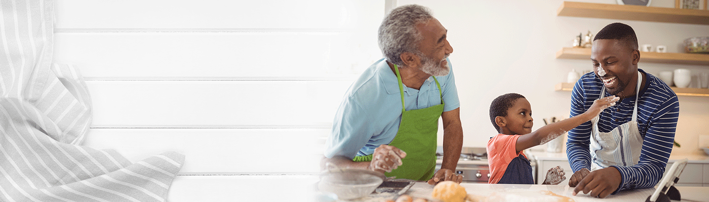 Picture of grandfather, father, and son in a kitchen.