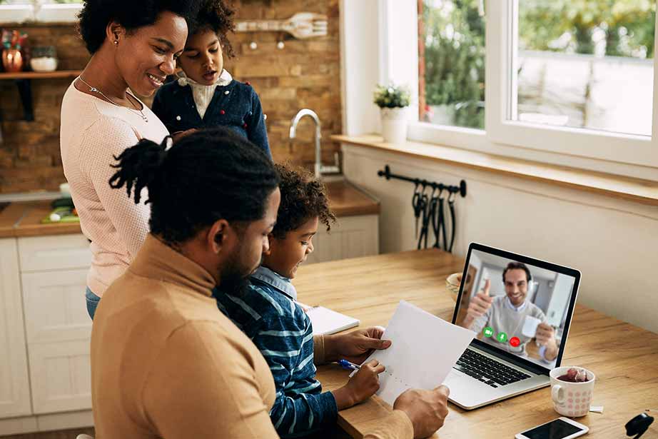 Picture of a family talking to an advisor online