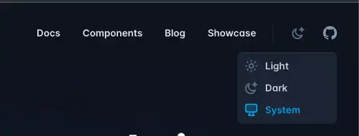 Tailwind CSS の公式サイトのヘッダーのスクリーンショット。Light, Dark, System のドロップダウンメニューが表示されていて、System が選択されている。
