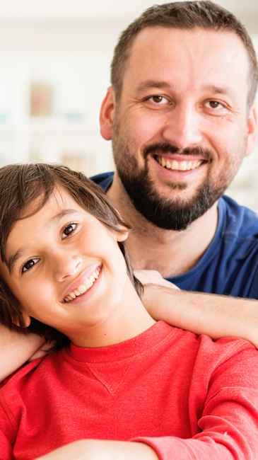 Father and son smiling