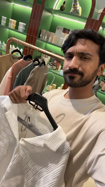 Customer browsing clothing in boutique inspired by Snapchat shopping experience.