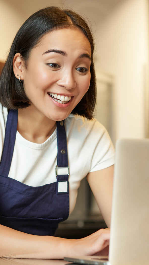 Woman looking at her laptop