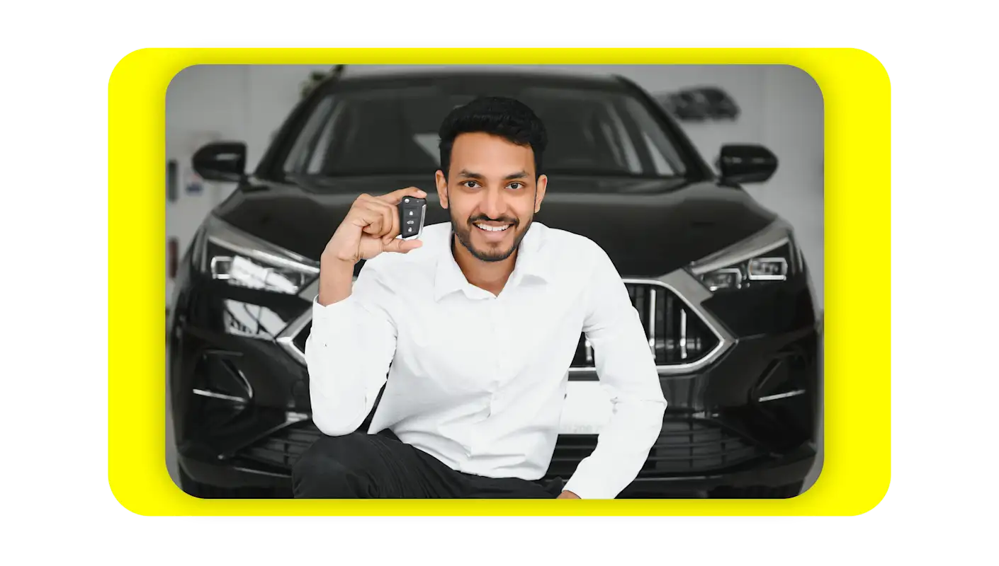 guy carrying key fob in front of his car