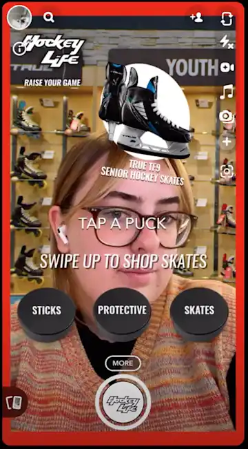 A woman uses the Pro Hockey Life AR Lens on Snapchat