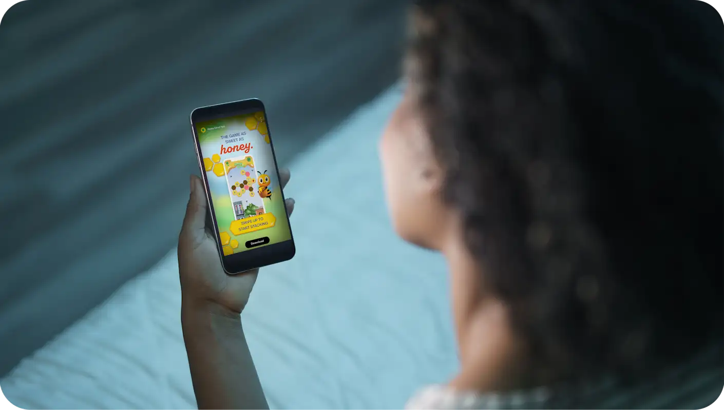 Woman playing a game on her mobile phone