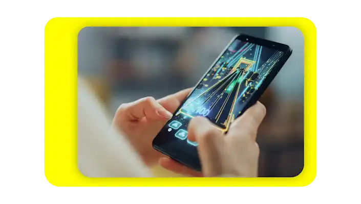Person playing a mobile video game on their cell phone.