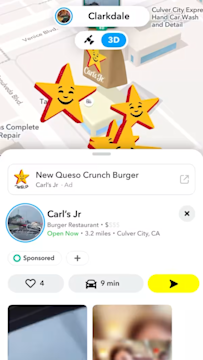 Snapchat map ad highlighting Carls Jr location with sponsored listing for Queso Crunch Burger promoting local discovery.