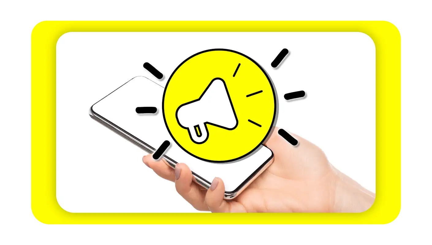 Horn icon over a hand holding a cell phone