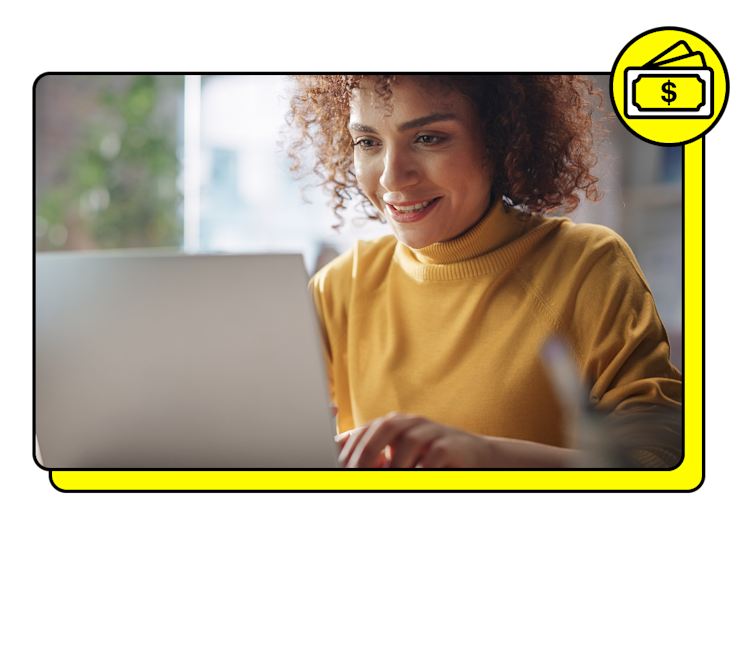 A Snapchat advertiser types on laptop with money icon in yellow above the photo