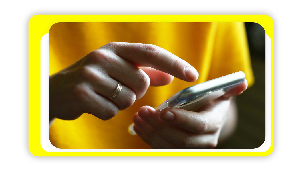 A woman's hand finger pressing on her cell phone.