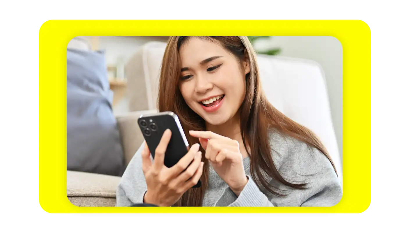 woman looking at cell phone
