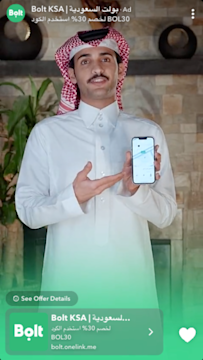 Snapchat ad featuring a man holding a phone displaying the Bolt app - a button at the bottom of the ad reads 'See Offer Details'