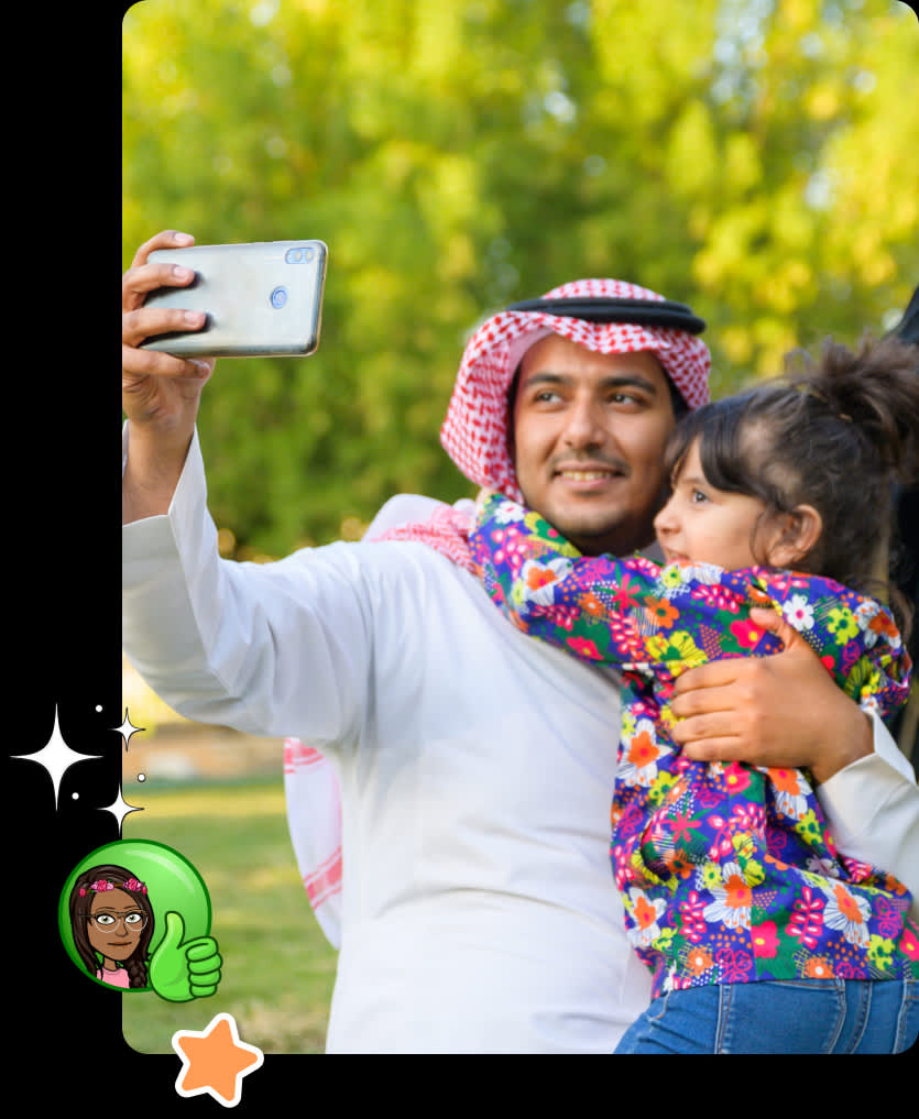 Father and daughter take a selfie outside