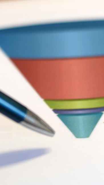 Close-up of image of a blue pen pointing at the bottom of a printed marketing funnel graphic colored blue, red, green, purple, and teal. 