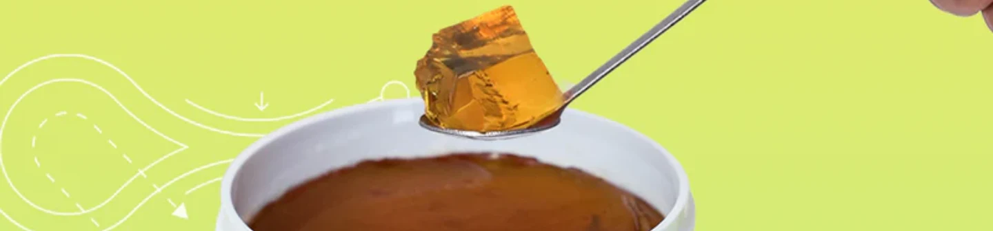 Close up of a scoop of Health Nag’s biotin collagen jelly on a spoon.