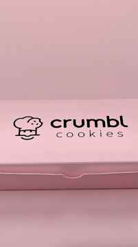 Pink box opens to delicious cookie flavors Snapchat ad by Crumbl