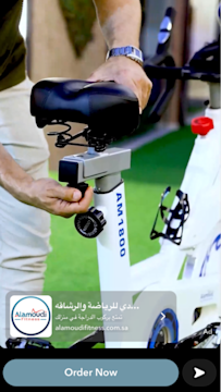 Al Amoudi Snapchat ad of a man adjusting the seat of a cycle machine.