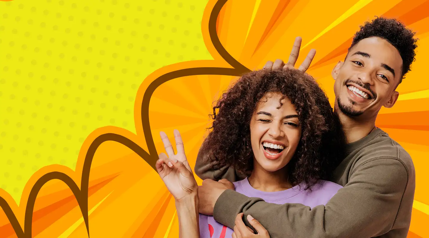 Two young customers use Snapchat to share a silly photo.