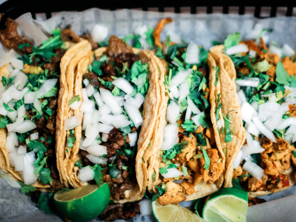 Image representing San Diego California | four street tacos with onions, cilantro, and halved limes on the side