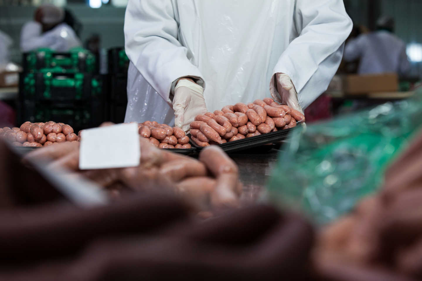 Warehouse operator manually handles sweet potatoes