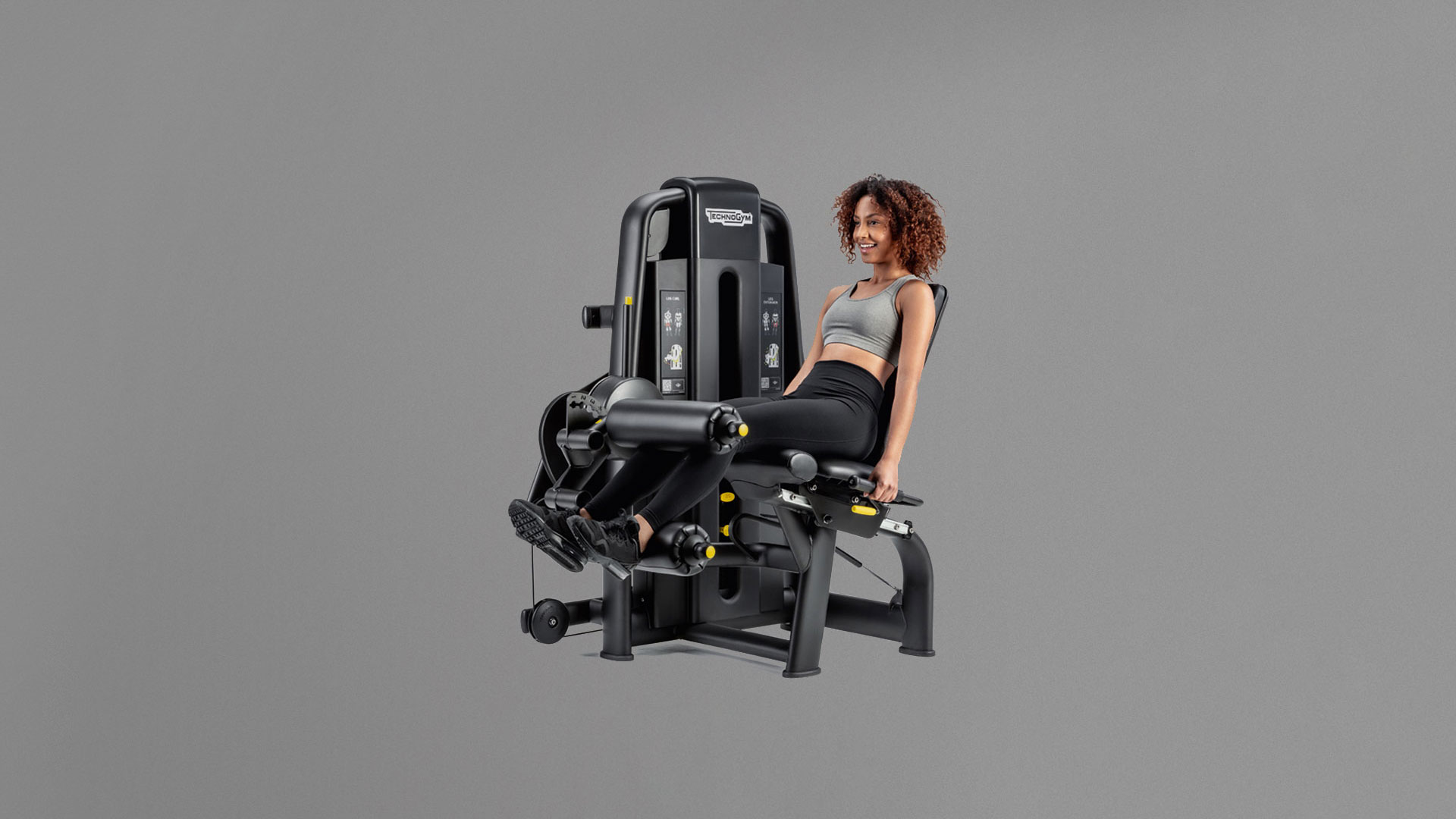 Gym machine for hamstrings & quadriceps: Technogym Dual Leg Curl