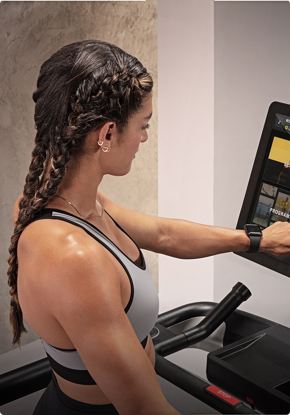 woman-configure-treadmill