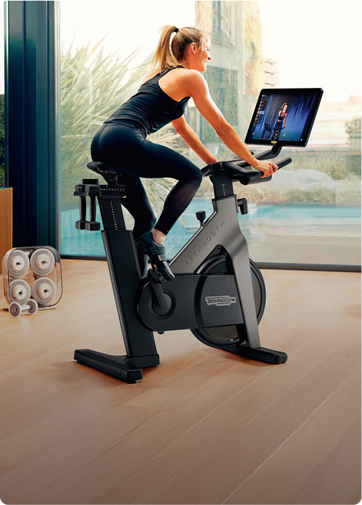 woman-technogym-bike