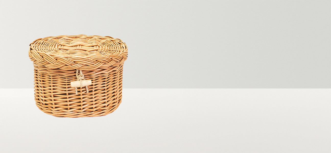 Small oval wicker basket with a wooden toggle                                                                                            