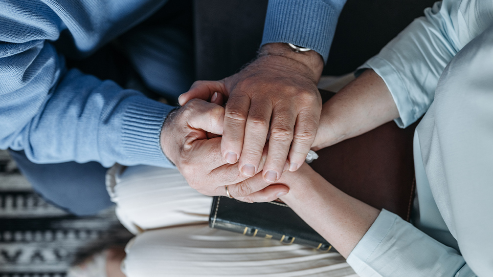 Man and woman holding hands