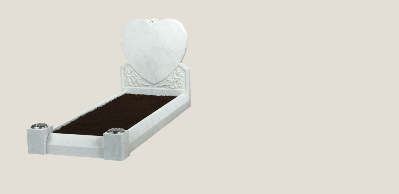 Carved heart memorial kerb set in white stone