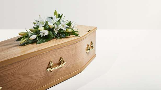 Lily spray on a coffin
