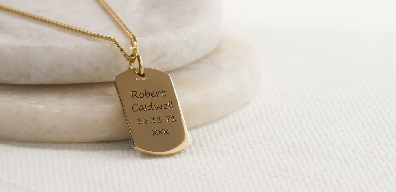 Gold inscribed pendant on a chain