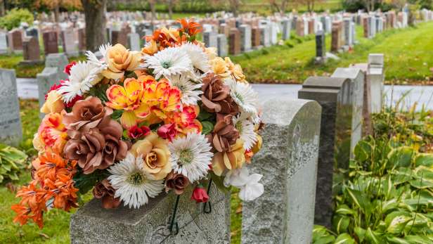 Autumnal flowers on a gravestone