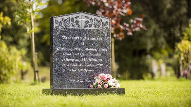 Headstone with roses and cross